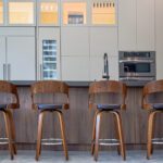 Four wooden stools in the Weston Residence kitchen.