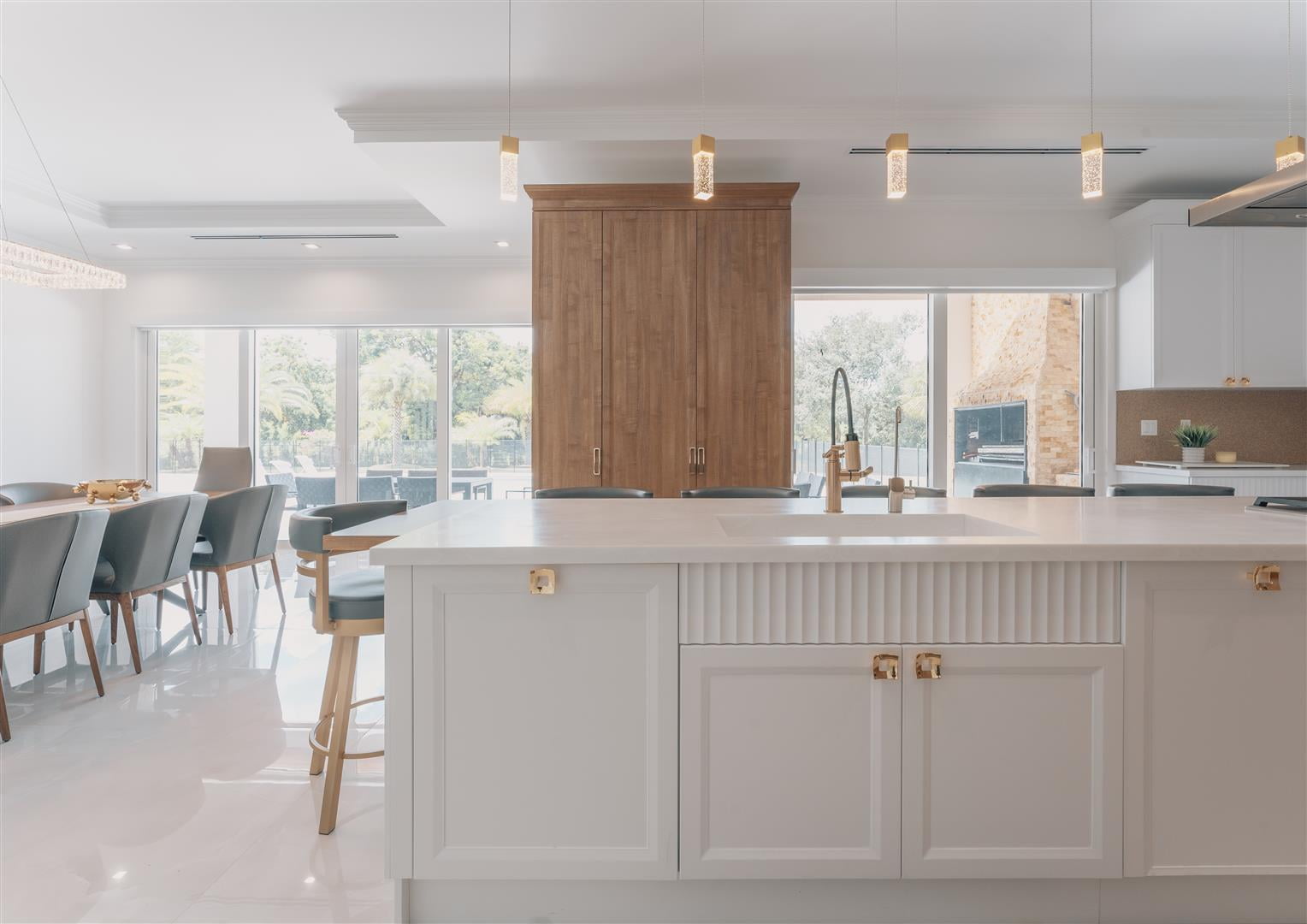 Design a modern kitchen with white cabinets and a large island.