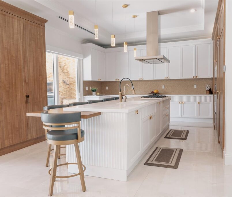 Design Keywords: Kitchen, wooden cabinets
Design description: A kitchen with wooden cabinets and bar stools.