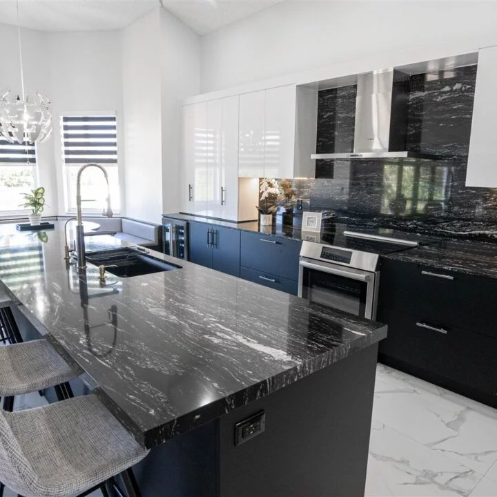 Pembroke Pines kitchen featuring black and white décor and marble counter tops.