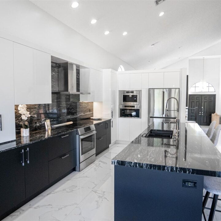 Pembroke Pines kitchen with black and white marble counter tops.