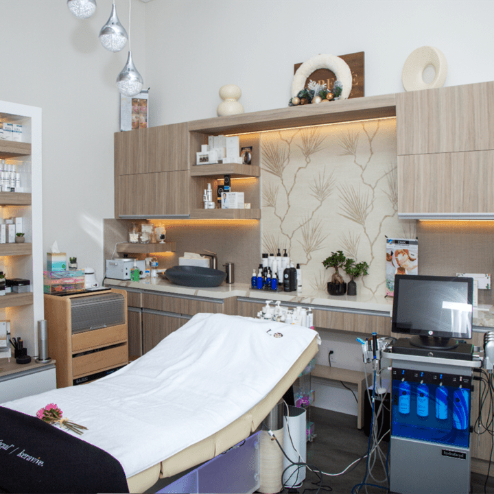 Cooper City Spa Project showcasing a beauty room and massage table.