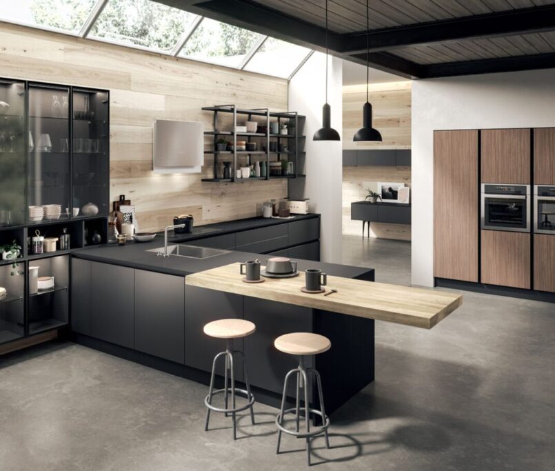 Modern kitchen design featuring sleek cabinetry and wooden accents.